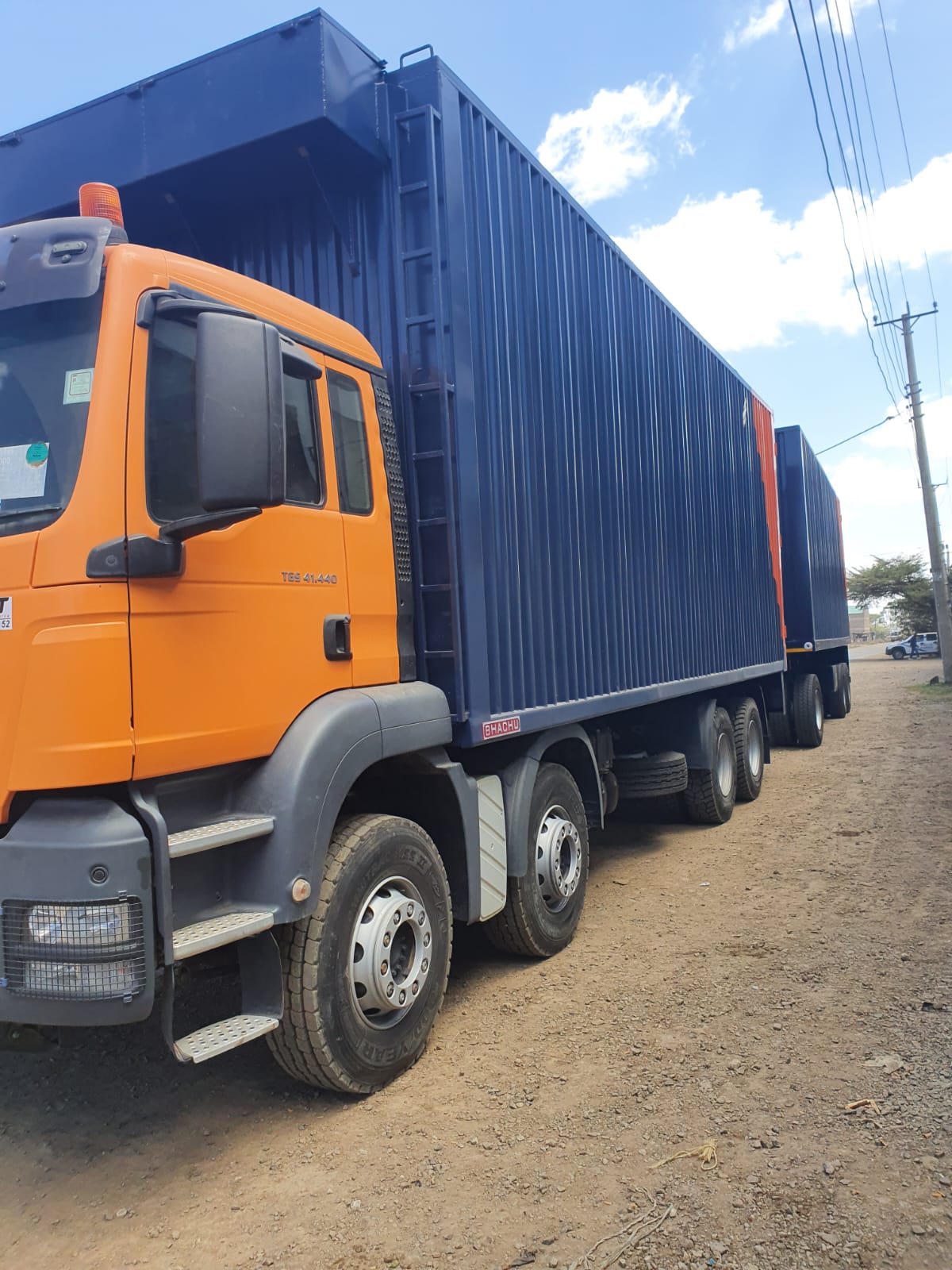 MAN TGS prime mover hauling a Bhachu-built box trailer on the road